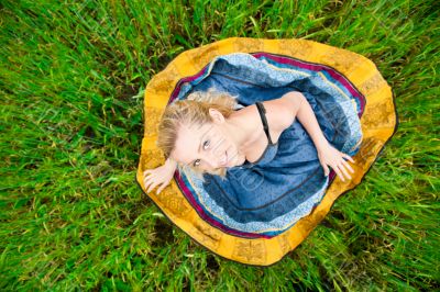 Portrait of the young beautiful smiling woman outdoors