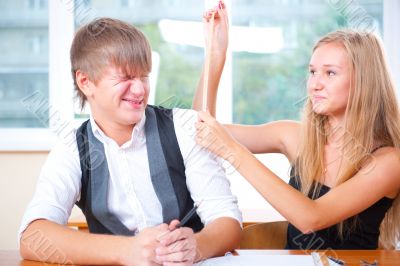 Portrait of college students working indoors looking happy