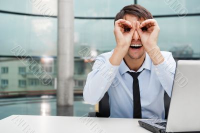 Closeup portrait of businessman looking for employees. Sitting i