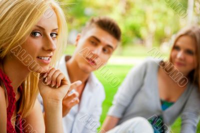 Portrait of three young teenagers laughing and having fun togeth