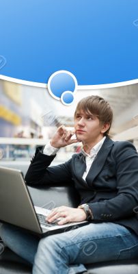 Portrait of handsome young man working with laptop at cafe at bu