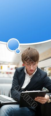 Portrait of handsome young man working with laptop at cafe at bu