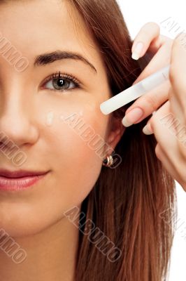 Face part of beautiful woman with cream on face on white backgro