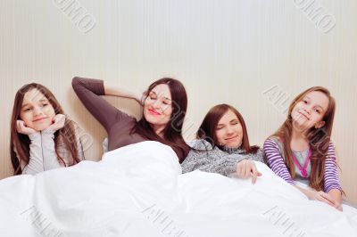 Portrait of happy family of only girls of different ages. 