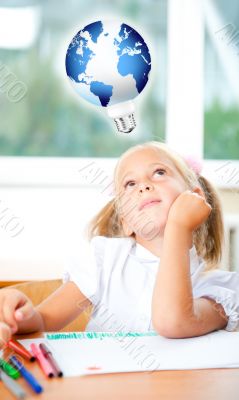 Little girl looking for a drawing concept wile painting picture 