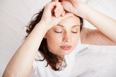 Portrait of a charming young lady relaxing on couch