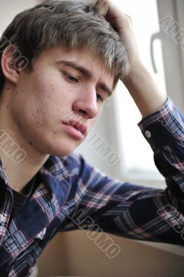 Happy young handsome man at home