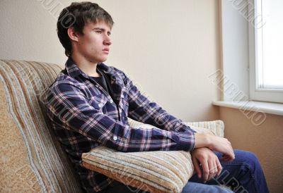 Happy young handsome man at home