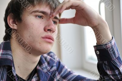 Happy young handsome man at home