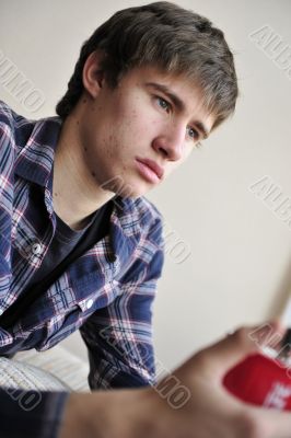 Happy young handsome man at home