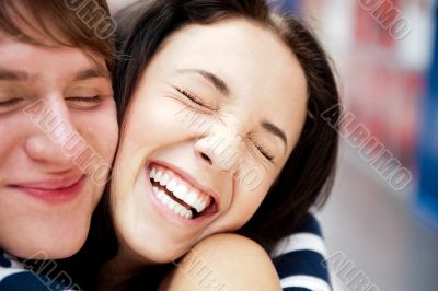 Young man meeting his girlfriend with opened arms at airport arr