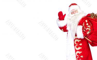 Santa Claus standing up on white background with his bag full of