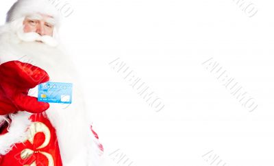 Traditional Santa Claus holding and sowing credit card while giv