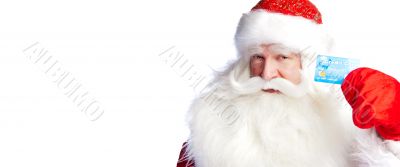 Traditional Santa Claus holding and sowing credit card while giv