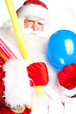 Traditional Santa Claus holding balloons for children. Isolated 