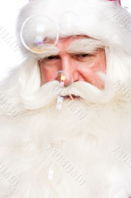 Santa Claus portrait smiling isolated over a white background an