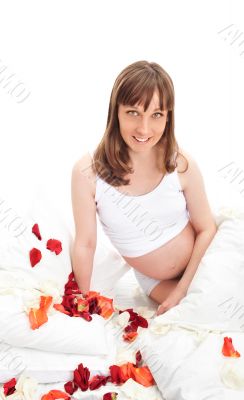 Image of pregnant woman touching her belly with hands