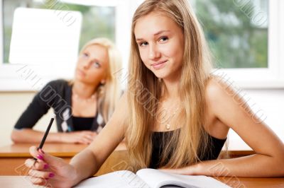 Portrait of a young group of students paying attention in class.