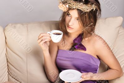 Young beautiful lady drinking coffee