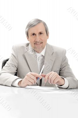 Portrait of an older businessman listening.