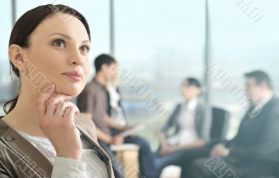 Portrait of a beautiful young businesswoman daydreaming.