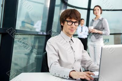 Closeup portrait of a handsome young man in a business suit. In 