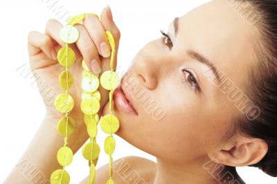 Pretty woman with yellow necklace