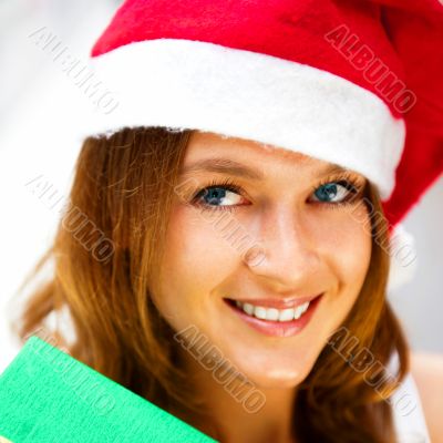 Portrait of young excited pretty woman standing inside shopping 