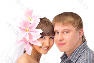 Closeup portrait of young caucasian bride and groom against whit