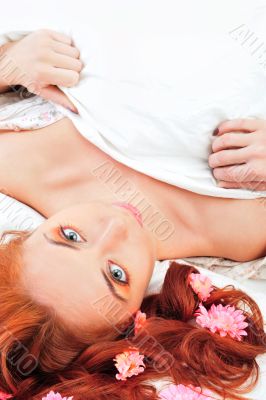 Closeup portrait of young beautiful caucasian woman with red hai