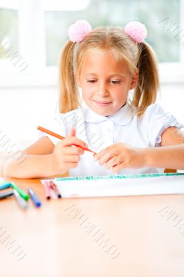Little girl looking for a drawing concept wile painting picture 