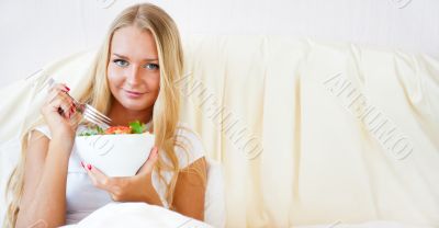 Closeup portrait of pretty caucasian woman having a healthy diet