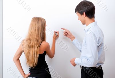 Closeup of adult teacher with student - explaining something