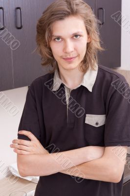 Portrait of a young man in his kitchen
