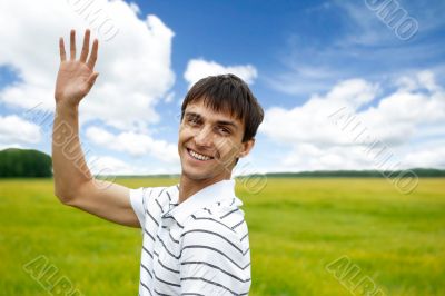 Portrait of young man taking energy from nature on vacation at c