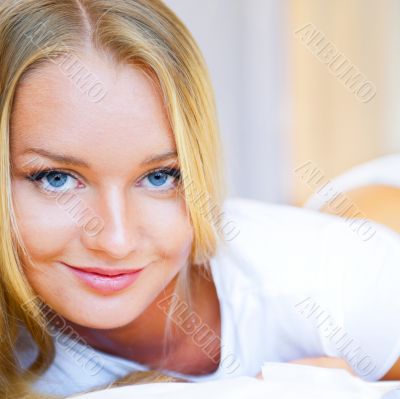 Woman having breakfast in bed. Healthy continental breakfast. Ca