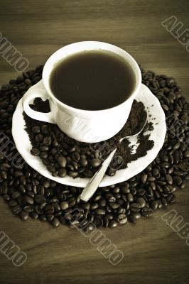 warm cup of coffee on brown background