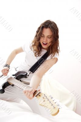 Portrait of young pretty girl who is feeling free and playing gu