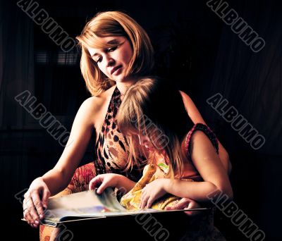 Closeup portrait of adult mother and her little daughter