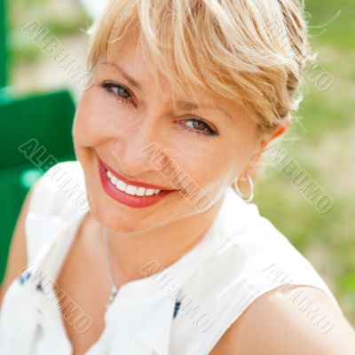 Portrait of a female smiling in a park