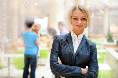 Portrait of a cute business woman with colleagues at the backgro