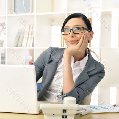 Portrait of a beautiful young businesswoman thinking.