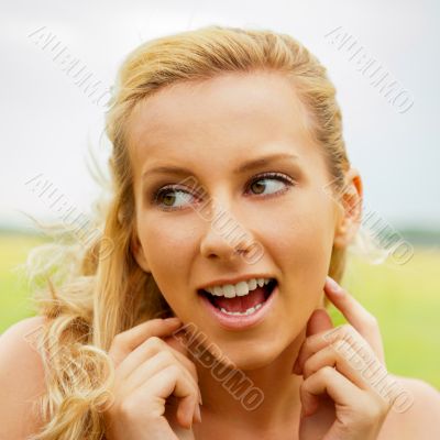 A portrait of a beautiful young Caucasian woman outdoor