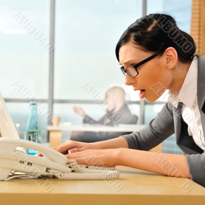 Closeup portrait of cute young business woman using laptop