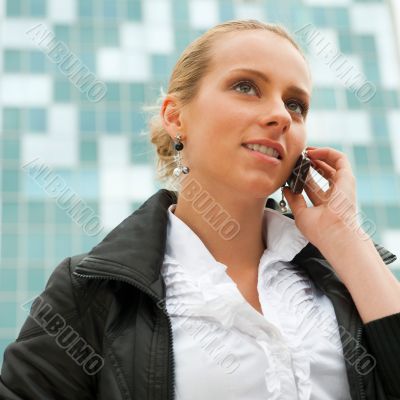 Portrait of pretty beautiful business woman on the phone with a 