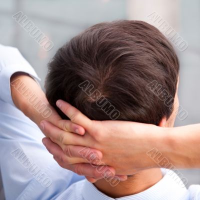 Closeup portrait of a smart young businessman smiling and his co