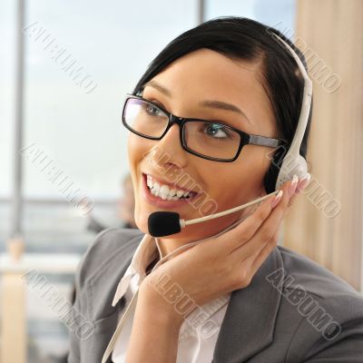 Portrait of a beautiful young businesswoman on the phone and hap