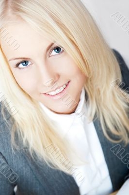 Closeup portrait of young pretty business woman in formal clothe