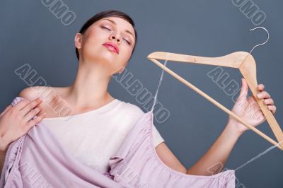 Portrait of pretty fashionable woman trying new clothes. Fashion