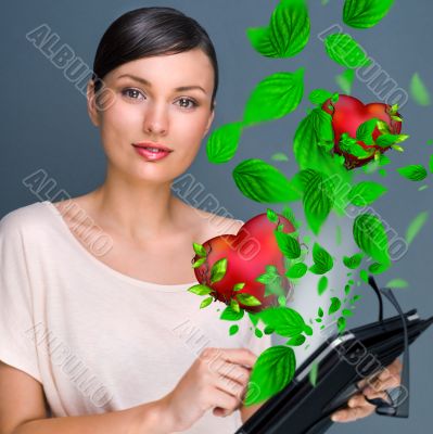 Portrait of young pretty woman holding tablet computer and glass